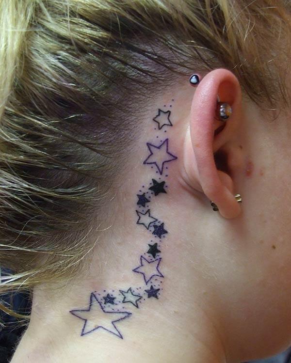A dreamy behind the ear tattoo design for women