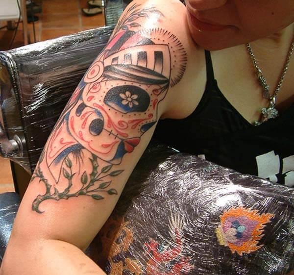 An attractive day of the dead tattoo design on arm for women