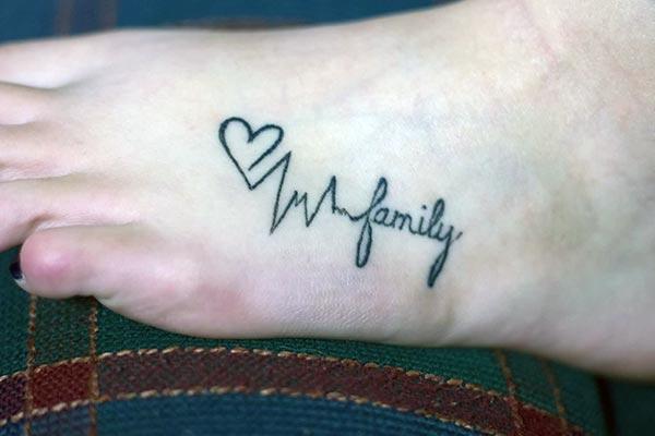 A catchy family tattoo design on foot for Girls