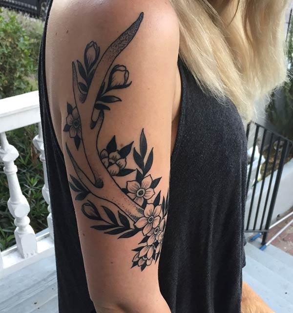 A charming half sleeve tattoo design for Ladies