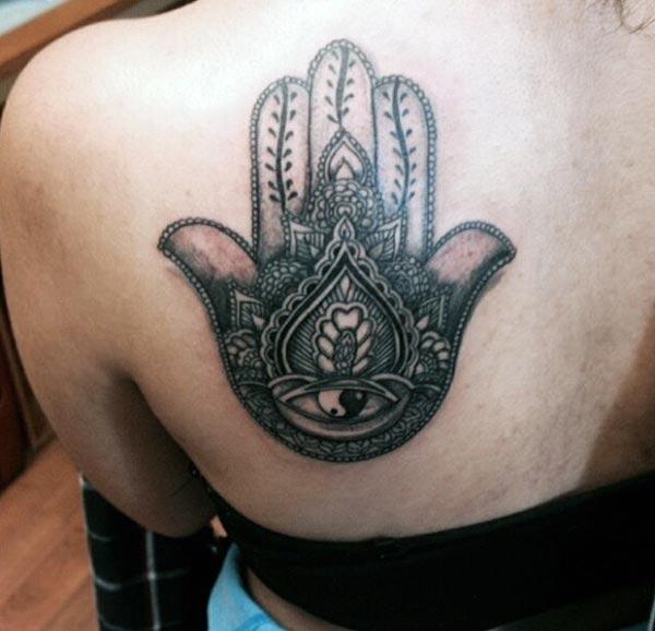 An intricate Hamsa tattoo design on back shoulder for girls