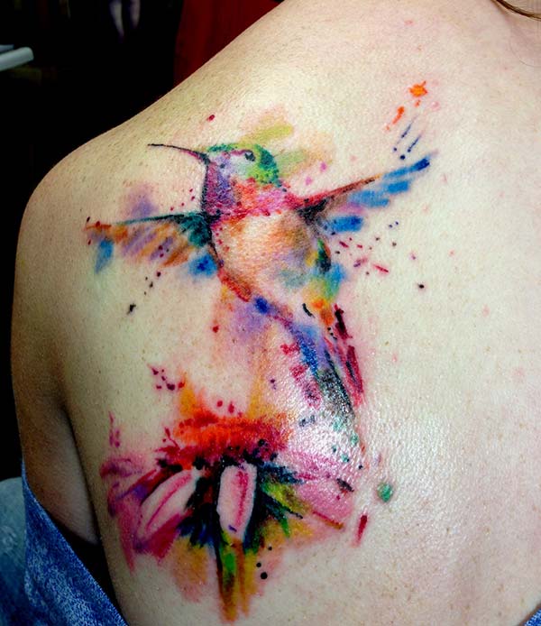 A stunning hummingbird tattoo design on side shoulder for women