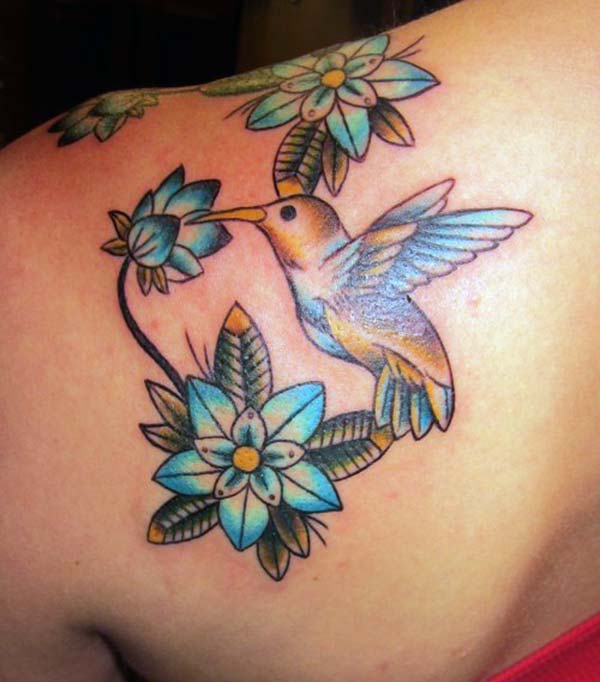 A stunning hummingbird tattoo design on side shoulder for women