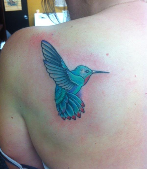 A cute little hummingbird tattoo design on side shoulder for girls