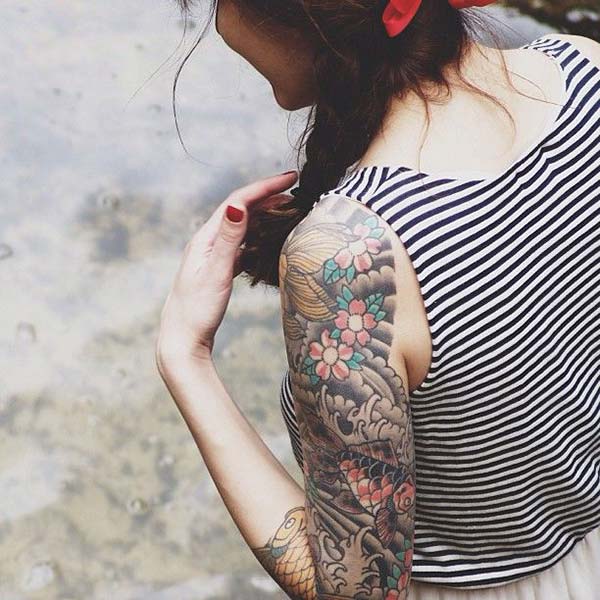 A beautiful Japanese tattoo design on upper arm for Ladies