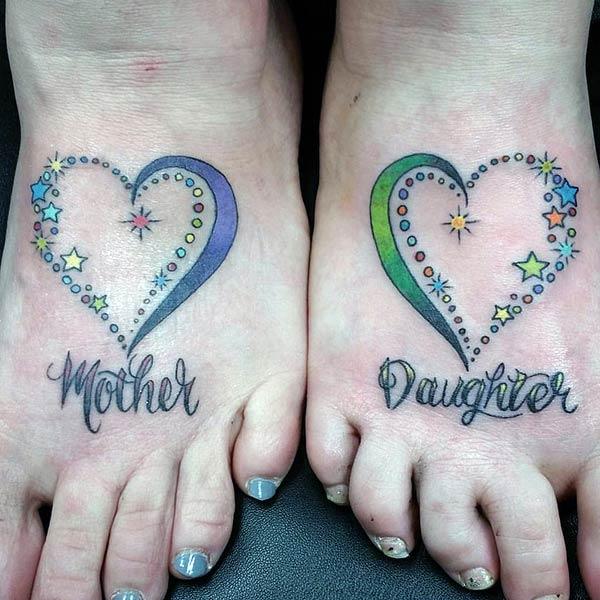 A beautiful mother daughter design on feet