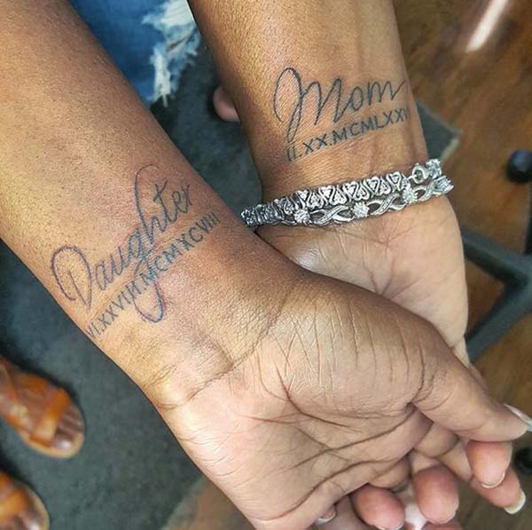 A classy mother-daughter tattoo design on wrist