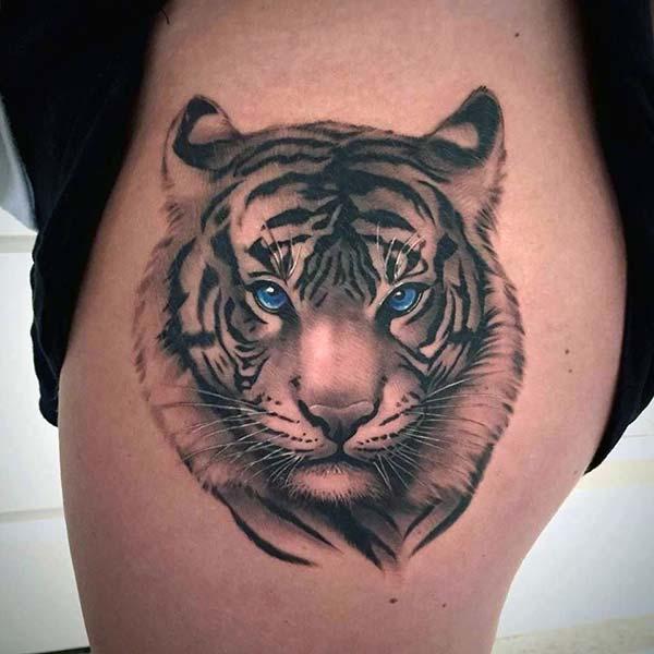 A gazing tiger tattoo design on thigh for Ladies