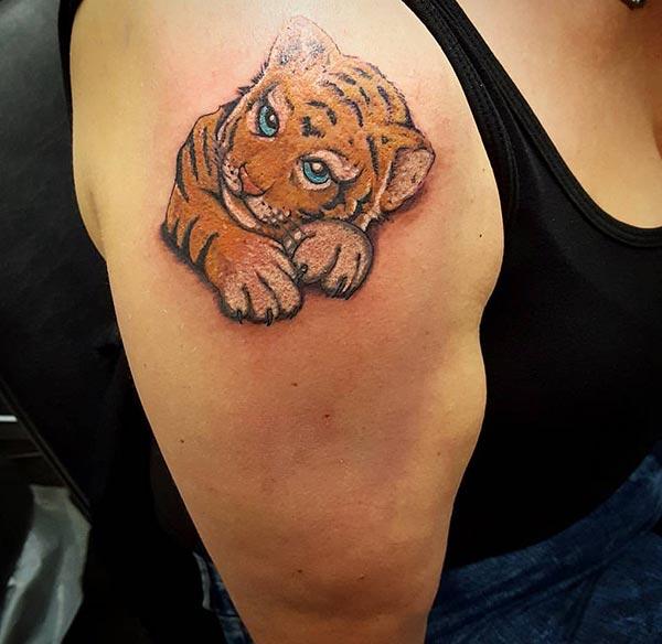 A delightful tiger tattoo design on shoulder for women
