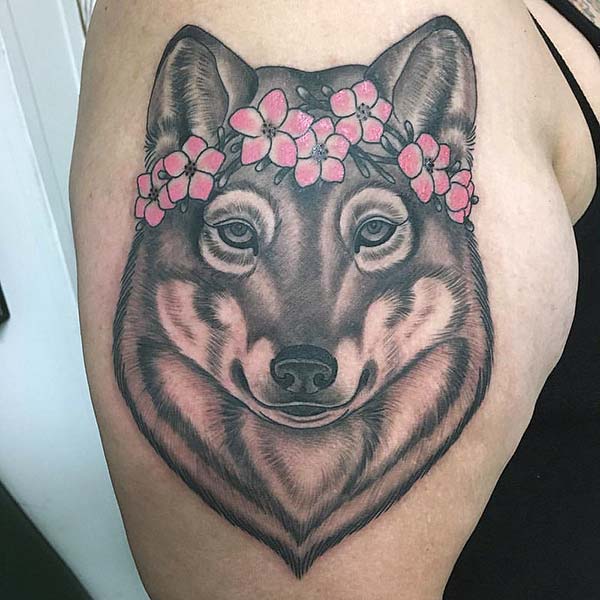 A lovely wolf tattoo design on shoulder for girls and women