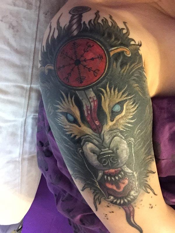 A magnificent wolf tattoo design on shoulder for Girls and women