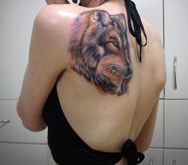 An enthralling wolf tattoo design on side shoulder for women