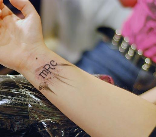 A catchy wrist tattoo design for women