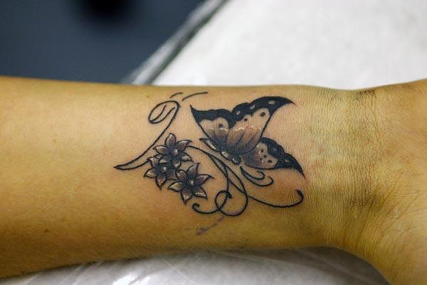 A delightful wrist tattoo design for girls and women